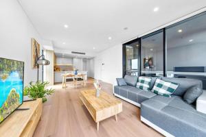 Ruang duduk di Adorable 2B Apt near Macquarie Uni
