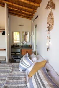 a bedroom with a bed and a sink at Northshore Point Zoritos in Caleta Grau