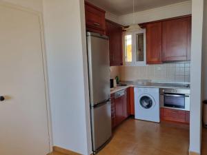Kuchyň nebo kuchyňský kout v ubytování Corfu Glyfada Beach Apartment 58a