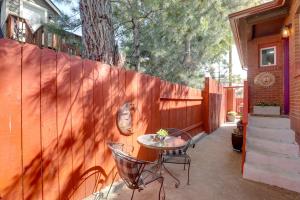a patio with a table and chairs next to a fence at Cozy Reno Vacation Rental Less Than 1 Mi to Midtown! in Reno