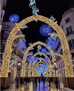 a christmas arch in a city with lights at SeaMed in Málaga