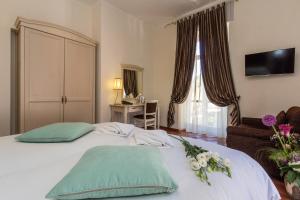 Letto o letti in una camera di Hotel Riviera