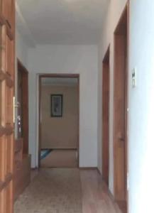 an empty hallway with two doors in a room at Žabljak Apartman in Žabljak