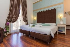 Letto o letti in una camera di Hotel Riviera