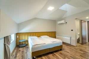 Postel nebo postele na pokoji v ubytování HOTEL VITAL