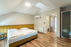 Postel nebo postele na pokoji v ubytování HOTEL VITAL