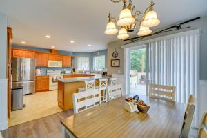 a kitchen with a table and chairs and a kitchen with a tableablish at Pet-Friendly Westport Vacation Rental with Hot Tub! in Westport