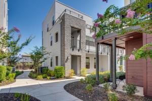an exterior view of a building with a pathway at Ideally Located Sacramento Townhome with 2 Balconies in Sacramento