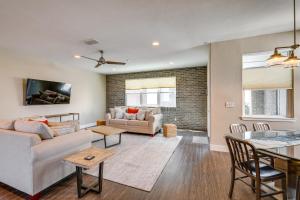 a living room with a couch and a table at Ideally Located Sacramento Townhome with 2 Balconies in Sacramento
