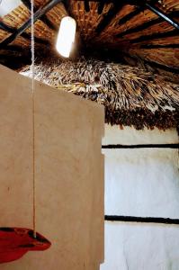 a light hanging from a ceiling with a rope at Casa Maya - Alberca - Wifi Starlink - Tour Sostenibilidad in Izamal