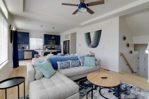 a living room with a couch and a table at 9 Mi to Airport Pet-Friendly Aurora Home with Deck in Aurora