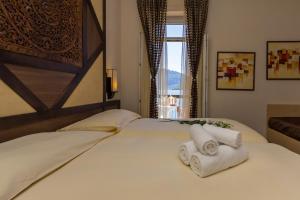 Letto o letti in una camera di Hotel Riviera