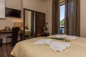 Letto o letti in una camera di Hotel Riviera