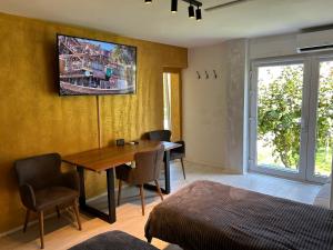 a room with a dining room table and a bed at APARTMENT GAL in Novo Mesto