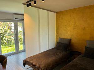 a room with a bed in a room with a window at APARTMENT GAL in Novo Mesto