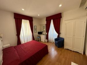 Voodi või voodid majutusasutuse Hotel L'Isola toas
