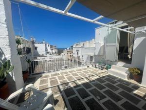 a balcony with a view of the ocean at Casa Sunshine in Ostuni