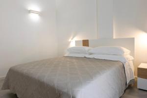 Postel nebo postele na pokoji v ubytování Sa Pasadina