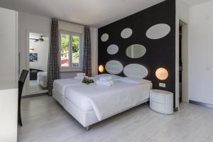 Letto o letti in una camera di Hotel Riviera
