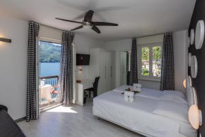 Letto o letti in una camera di Hotel Riviera