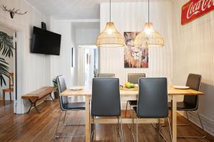 a dining room with a table and chairs at MtlVacationRentals - MTL ZOO in Montréal