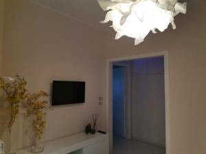 En tv och/eller ett underhållningssystem på Caso Apartments-Luxury Houses