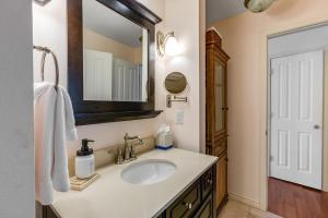 a bathroom with a sink and a mirror at Woodbridge Condo by Snowmass Vacations in Snowmass Village