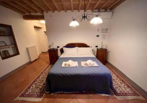 Postel nebo postele na pokoji v ubytování B&B Giardino delle Camelie