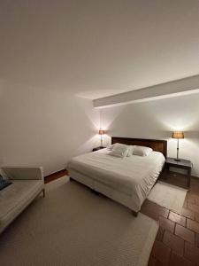 Säng eller sängar i ett rum på Bastide de l'Hermitan - Golfe de Saint Tropez