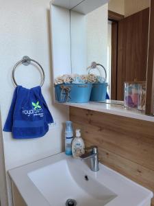 a bathroom with a sink and a mirror at Fantastic Beach condo with pool and mountain views in Nueva Gorgona