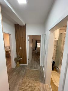 a hallway of a apartment with a room at Apartman Prodan in Sombor