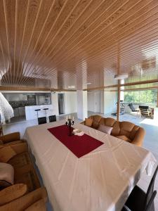 a large living room with a large table and couch at Havaalanına yakın, karşısı orman ferah bir daire. 