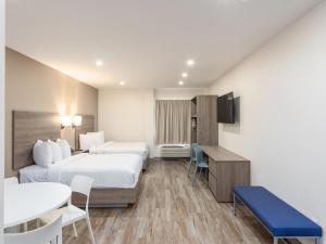Postel nebo postele na pokoji v ubytování Hotel Mesaluna Short & Long Stay