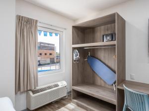Postel nebo postele na pokoji v ubytování Hotel Mesaluna Short & Long Stay