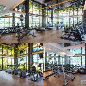 a gym with a lot of treadmills and exercise bikes at supalai city resort in Ban Khlong Samrong