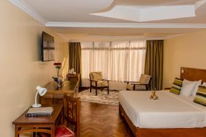 Voodi või voodid majutusasutuse The Glacier Hotel Nanyuki toas