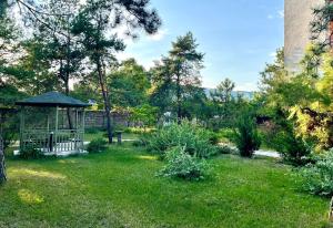 a gazebo in the middle of a yard at Ассоль in Koblevo