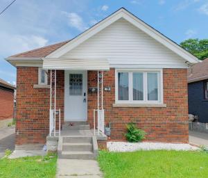 a red brick house with a white door at 2B with parking, 10km to Toronto downtown in Toronto