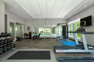 a fitness room with a gym with a treadmill at Home2 Suites By Hilton Huntsville in Huntsville