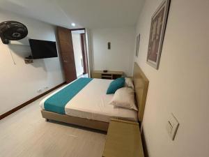 Postel nebo postele na pokoji v ubytování Amoblados Medellin Poblado