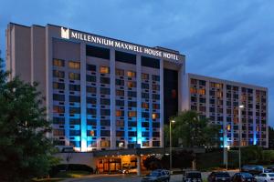 a large building with blue lights in a parking lot at Millennium Maxwell House Nashville in Nashville