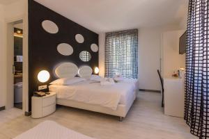 Letto o letti in una camera di Hotel Riviera