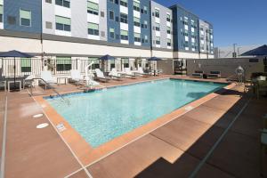 a large swimming pool in front of a building at Hyatt House Vacaville in Vacaville