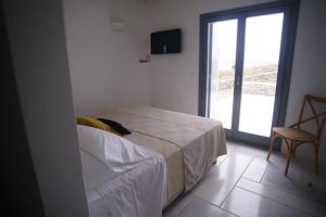 Postel nebo postele na pokoji v ubytování Krotiri View Paros