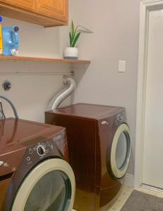 a washing machine next to a dryer in a room at Contemporary Zen Place - Entire First Floor in Thousand Oaks