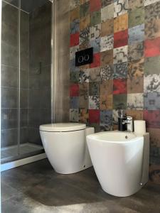A bathroom at Colosseo Suite Még 32 kép