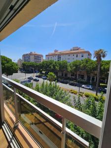 a balcony with a view of a street at Studio Le Santa-Maria - Frejus Plage in Fréjus