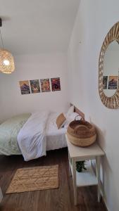 a bedroom with a bed and a table with a mirror at Luxury peaceful, free parking in Rechovot