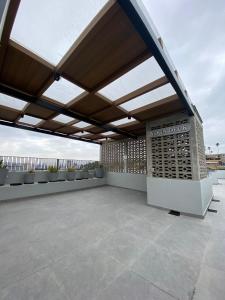 a large patio with awning on a building at CENTRICO TJ in Tijuana