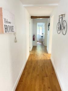 a hallway with a bike hanging on a wall at Alojamiento Singular Casa Haraiz in Jaraiz de la Vera